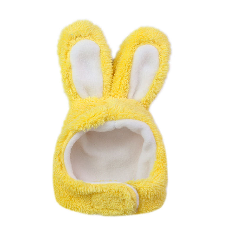 Yellow plush bunny hat with white interior on a white background