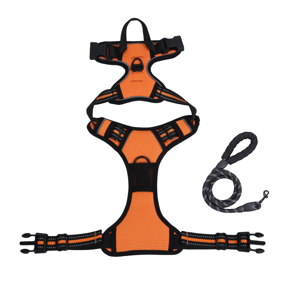 Orange and black dog harness with a leash on a white background