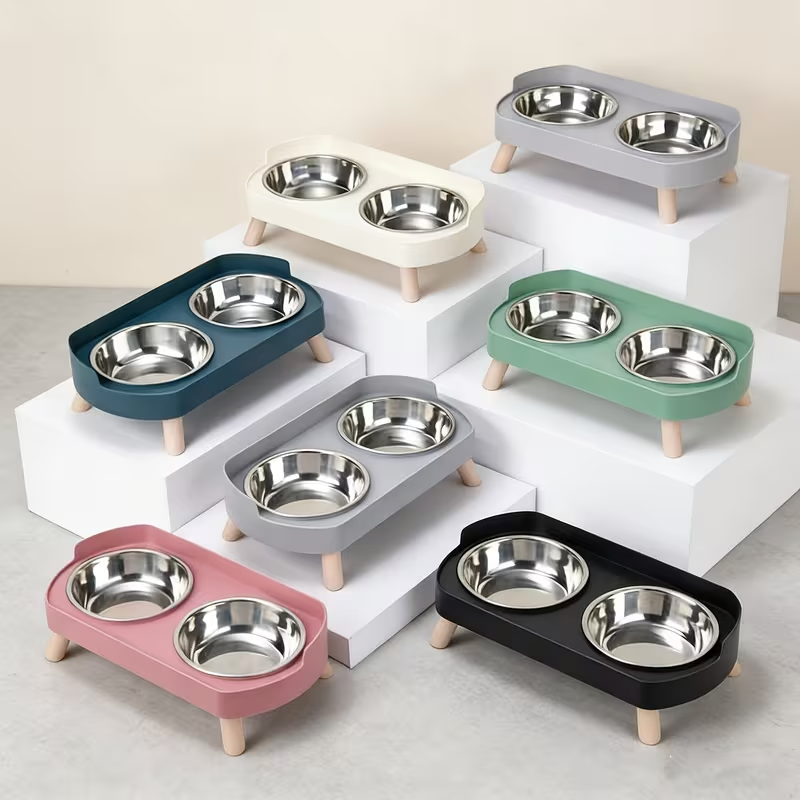 Set of colourful pet bowls with multiple bowls on a neutral background