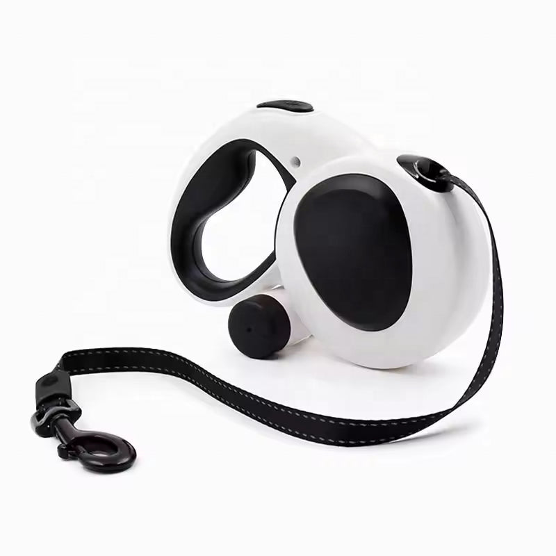 White and black retractable dog leash on a white background