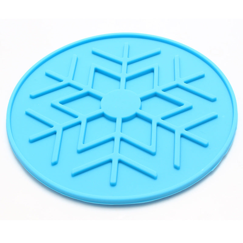 Blue silicone mat with snowflake pattern on a white background