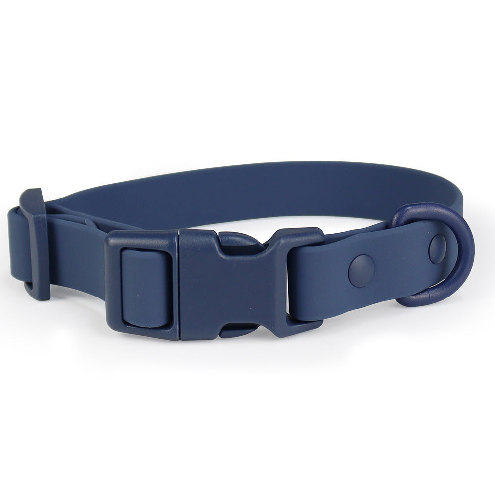 Navy blue dog collar with a buckle on a white background
