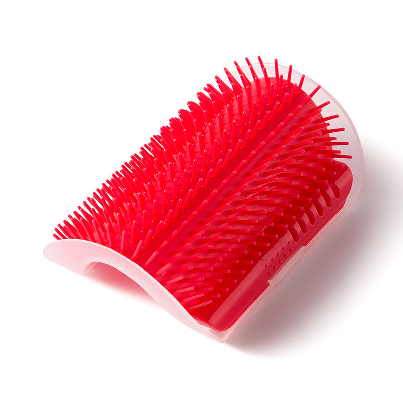 Red grooming brush with a white handle on a white background