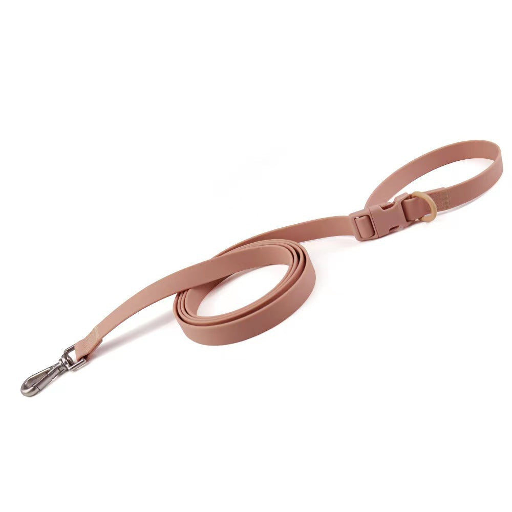 Pink dog leash with a clip on a white background
