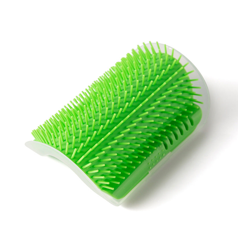 Green grooming brush on a white background