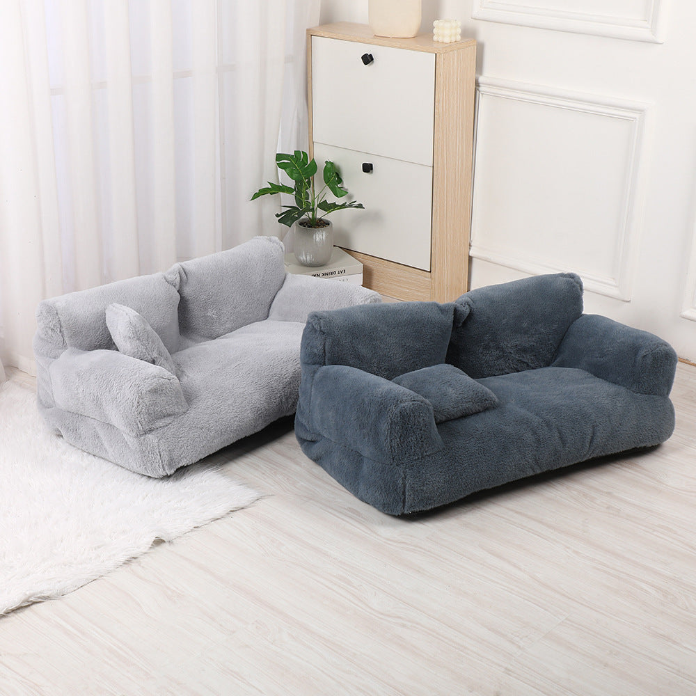 Two plush, bean bag-style chairs in grey and dark grey on a light wooden floor.