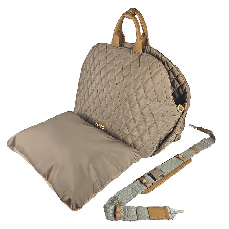 Quilted beige seat cover with straps on a white background