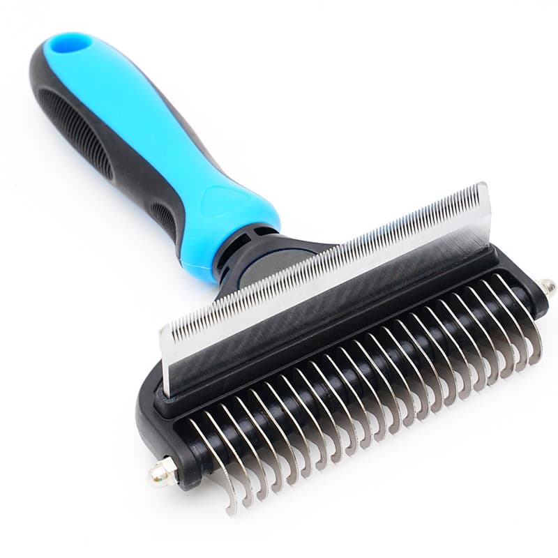 Pet grooming brush with blue handle on a white background