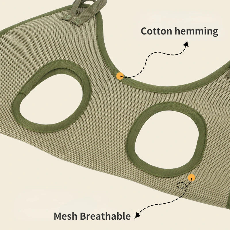 Green mesh cat harness with cotton hemming and breathable design on a beige background