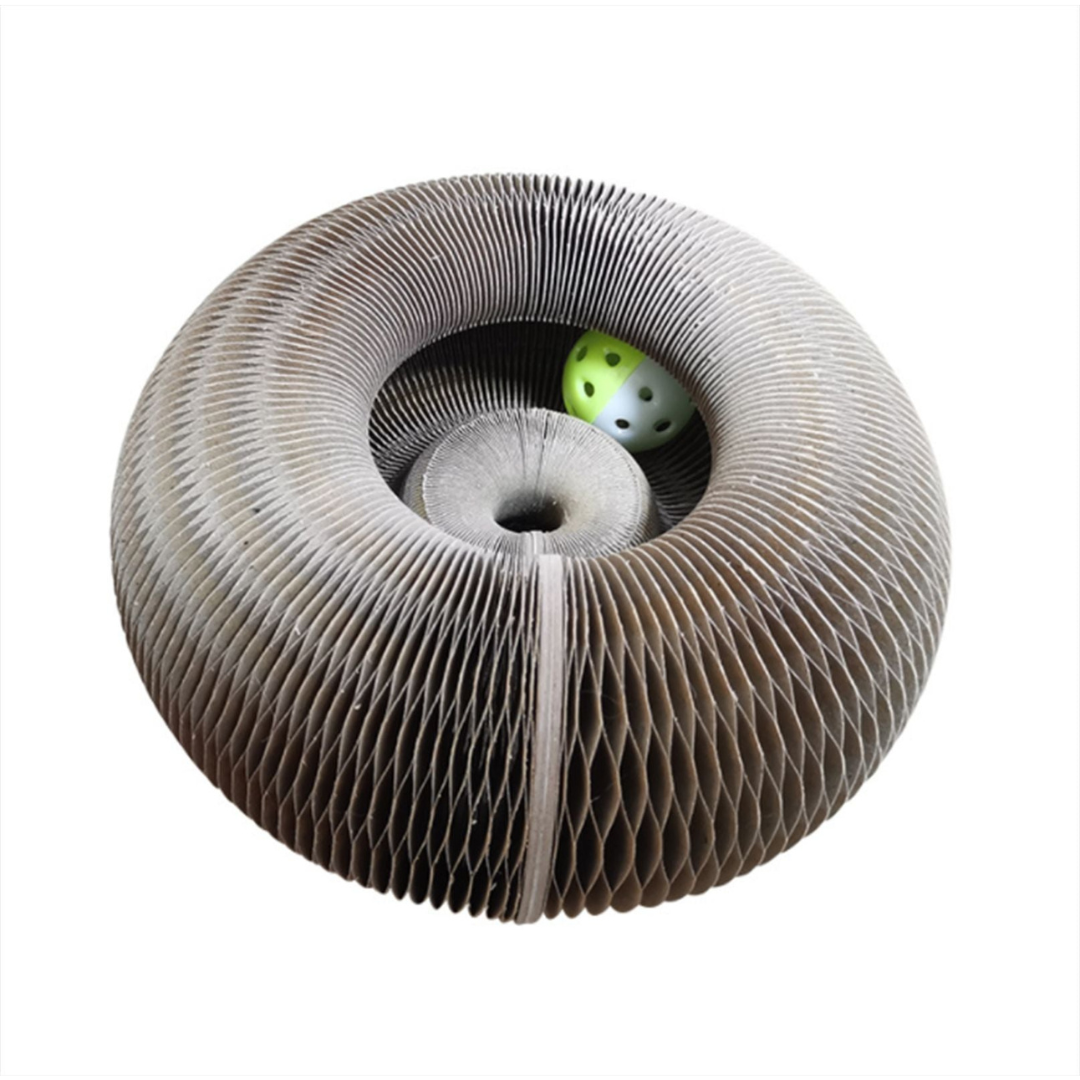 Cardboard cat toy with a green ball inside on a white background