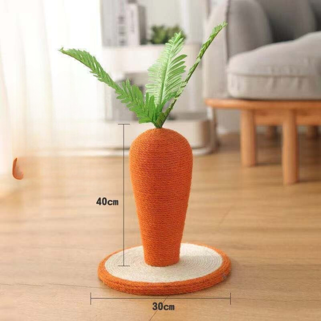 Carrot-shaped cat toy with green leaves on a wooden floor, showing measurements.