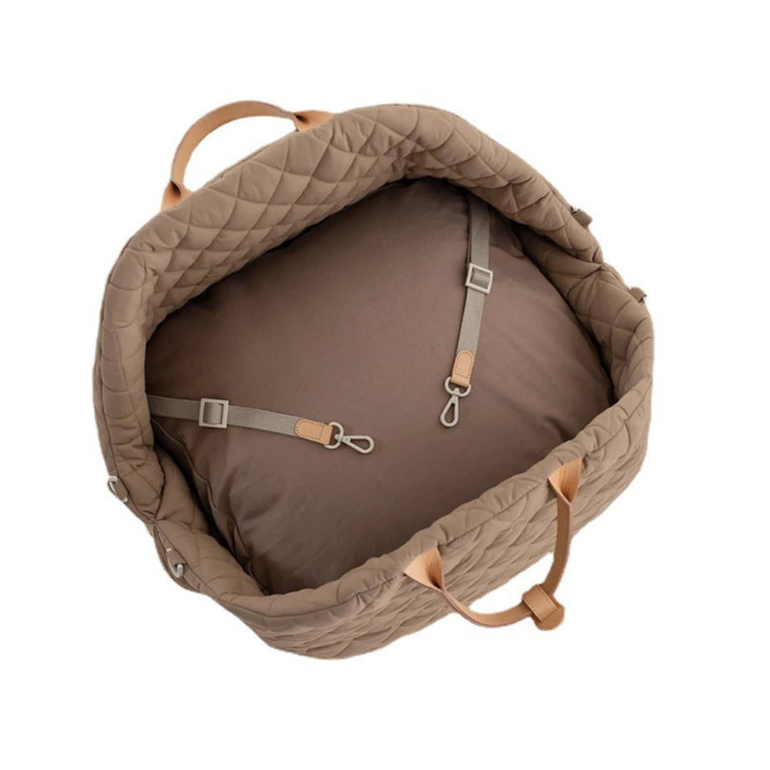 Brown quilted backpack with straps on a white background