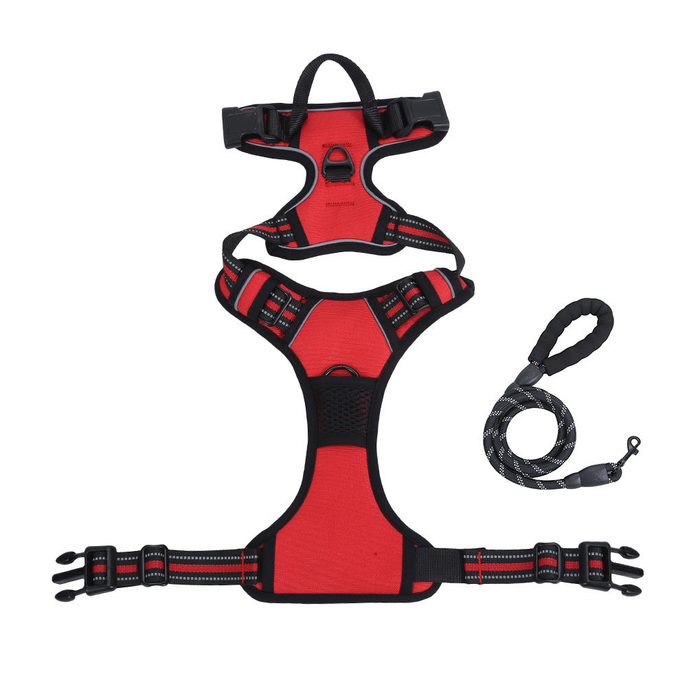 Red and black dog harness with a leash on a white background