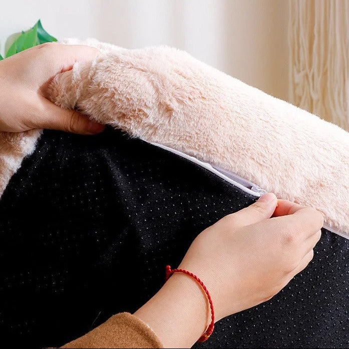 Person opening a black pet bed with a fluffy beige cover