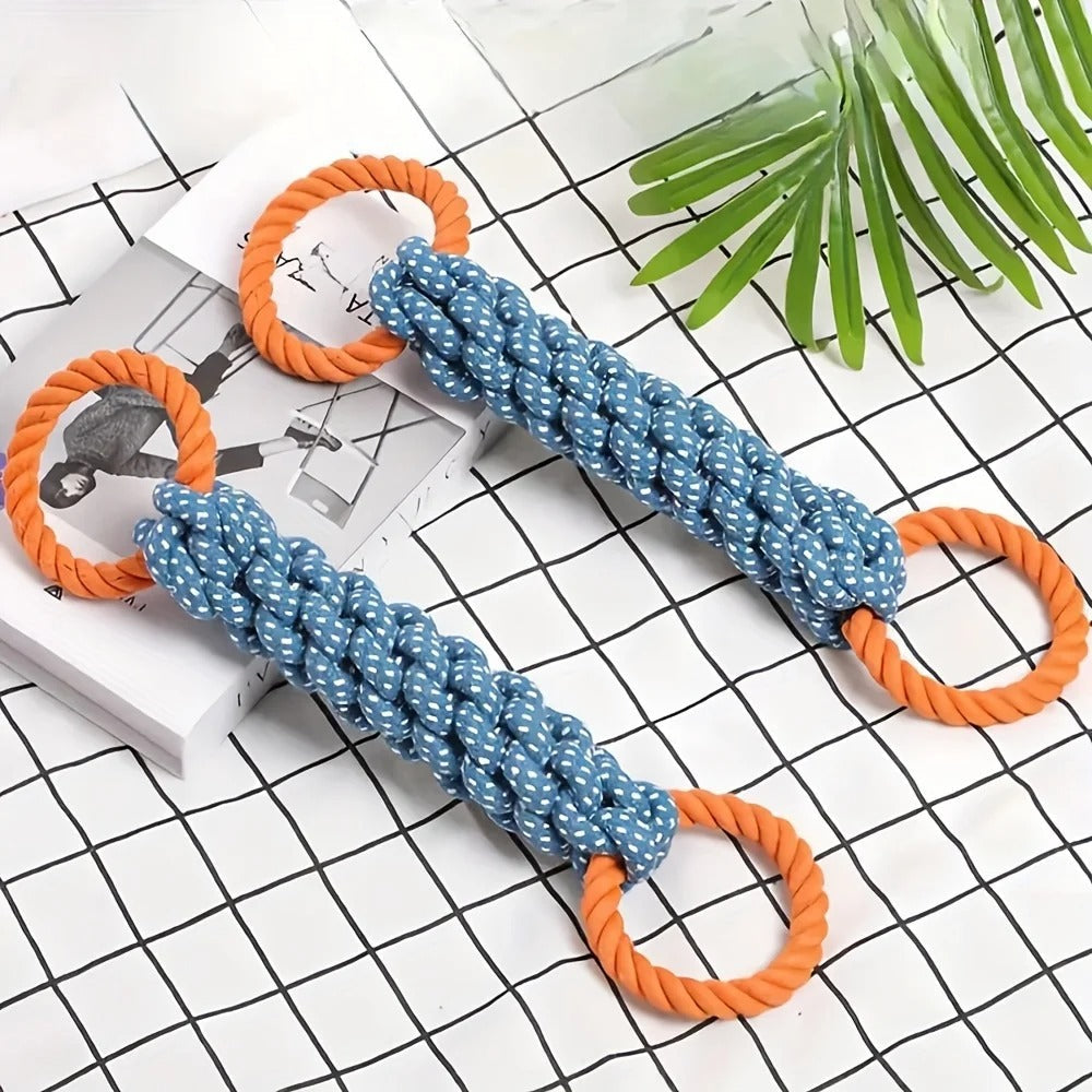 Blue and orange dog toy with rope on a checkered background