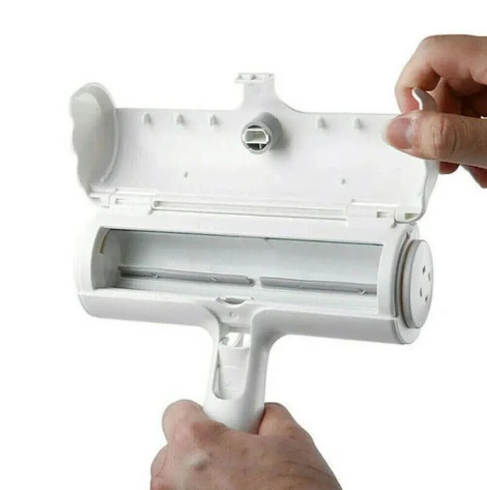 White roller cleaning tool held by a hand on a white background