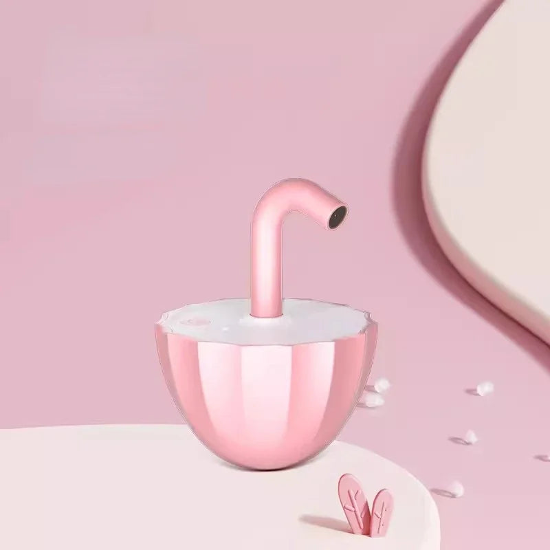 Pink faucet-like cat toy on a pink background