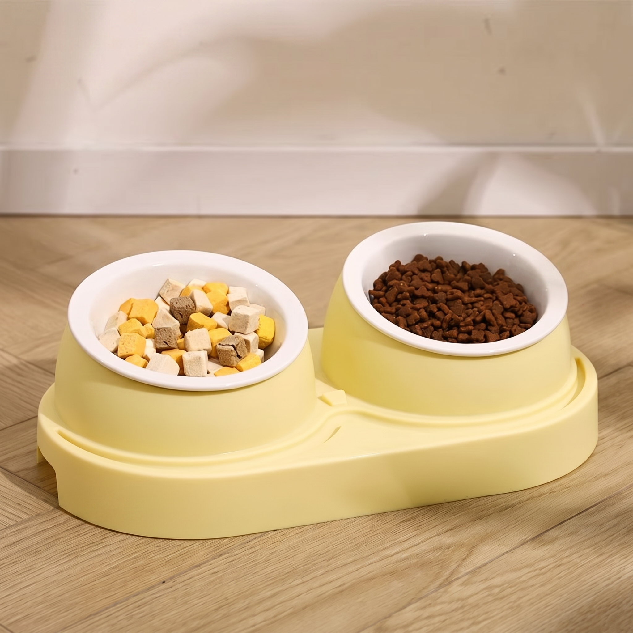 Pet food bowl set with dry and wet food on a wooden floor.