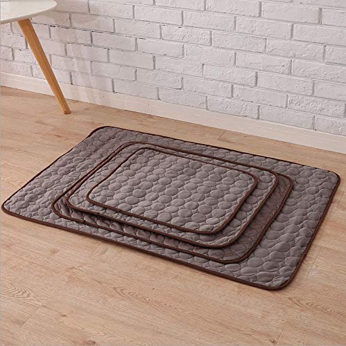 Set of four textured pet self cooling mat on a wooden floor with a brick wall background
