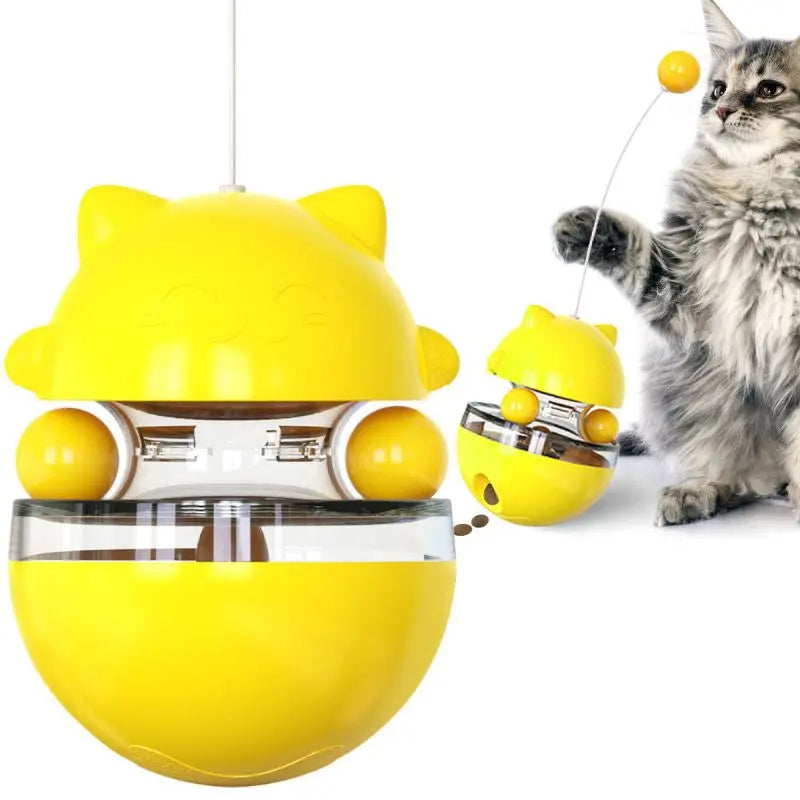 Yellow cat-shaped toy with a clear bottom section, next to a cat playing with it.