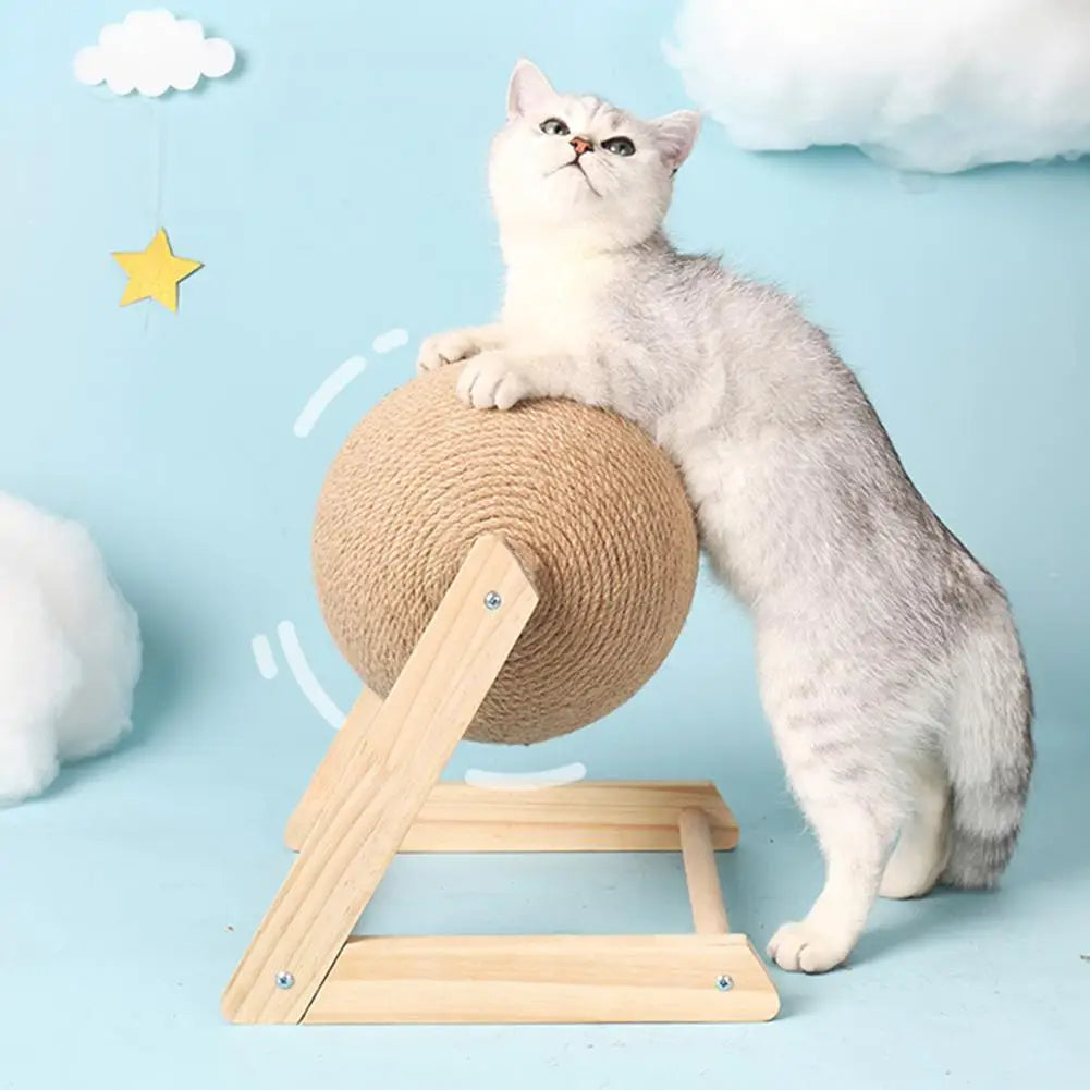 Cat playing with a cardboard ball on a stand against a light blue background with cloud decorations.