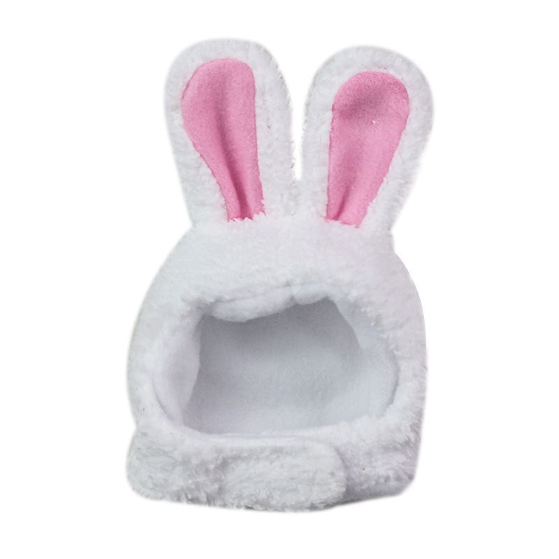 White pet hat with pink bunny ears on a white background