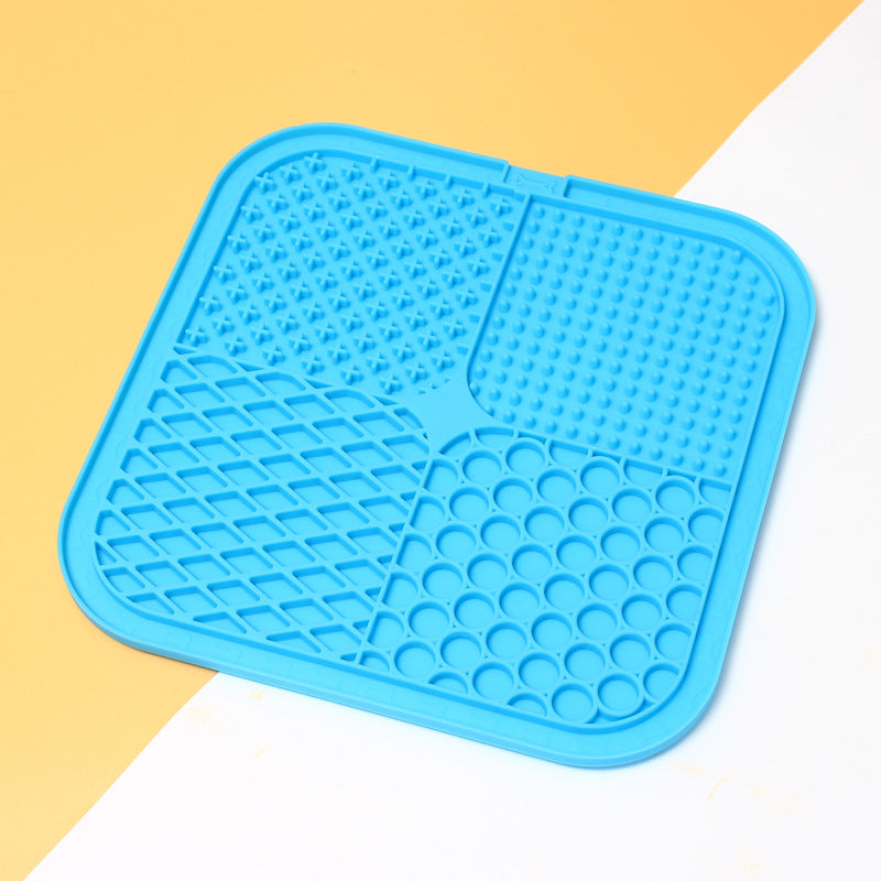 Blue silicone mat with textured surface on a two-tone background