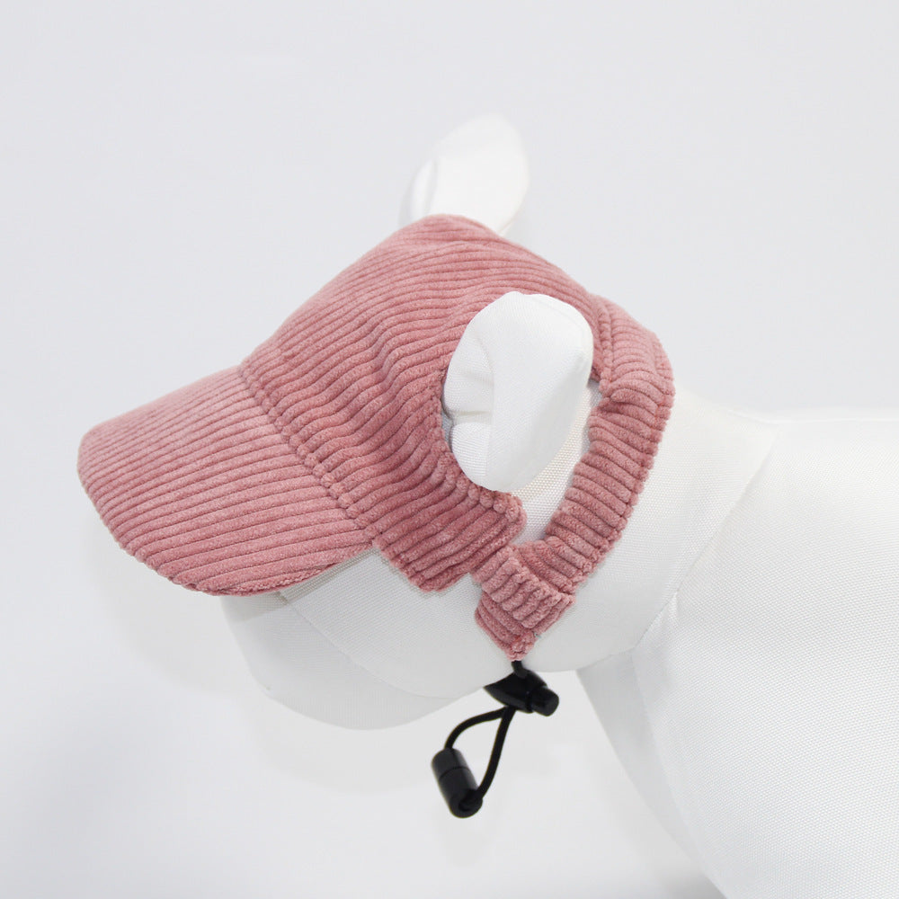Pink knitted eye mask on a mannequin head against a white background
