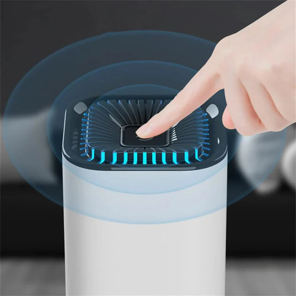 Hand pressing a button on an air purifier with a dark background