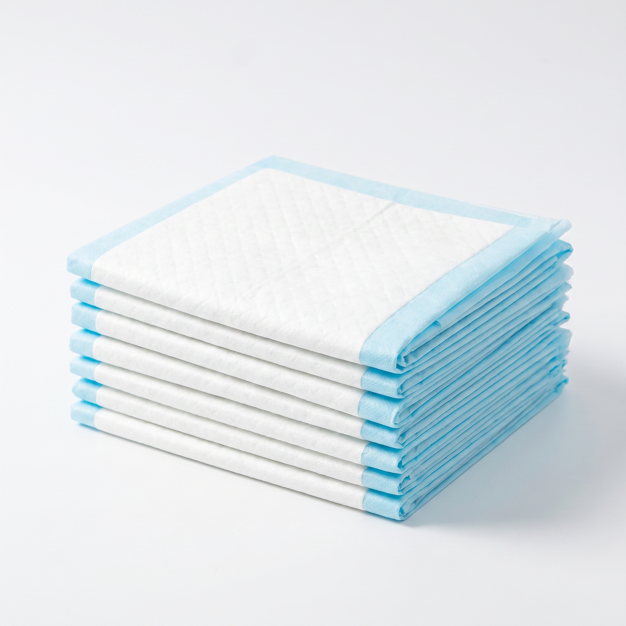Stack of white disposable diapers  for cats and dogs with blue edges on a light grey background
