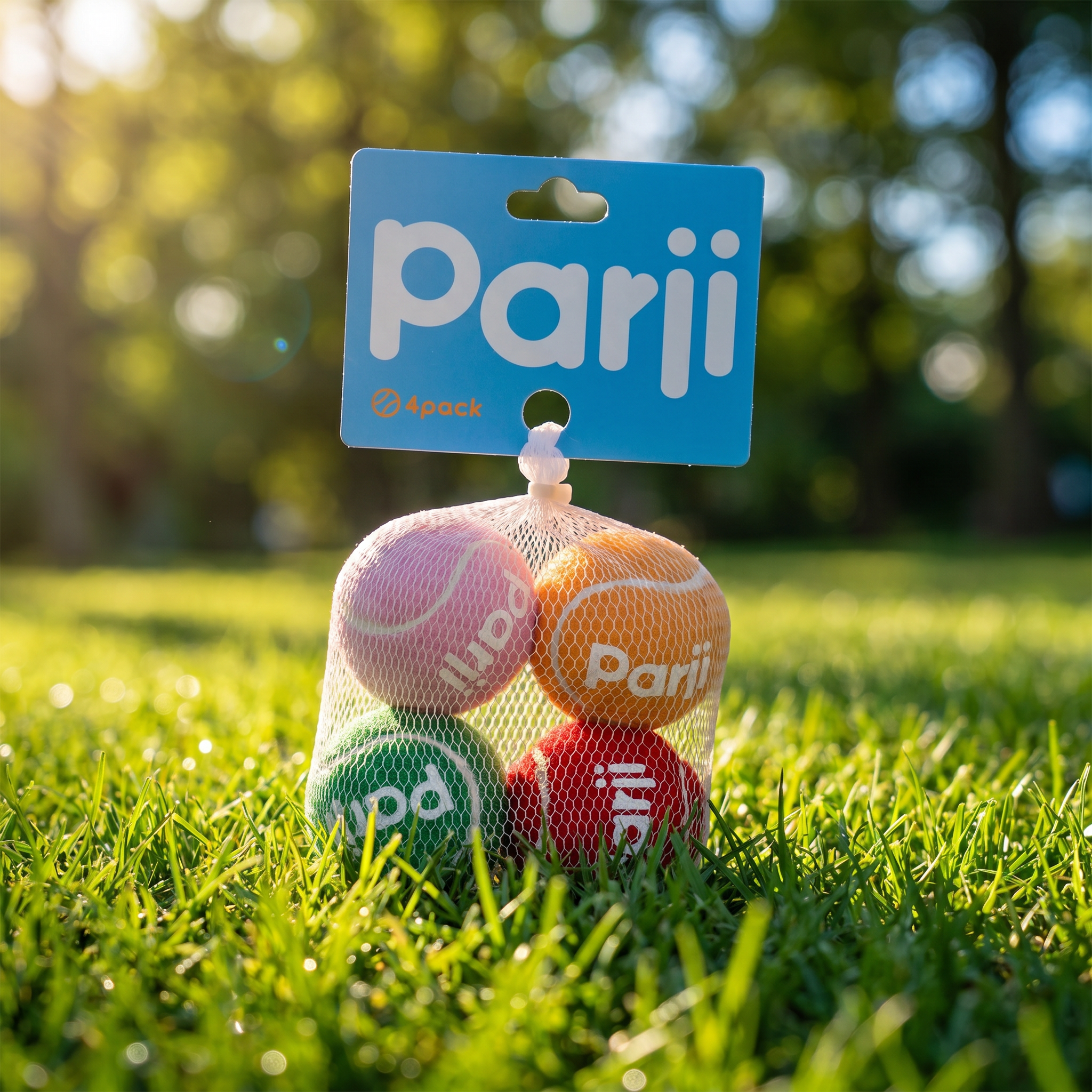 Colorful tennis balls in a package with 'parji' branding on grass