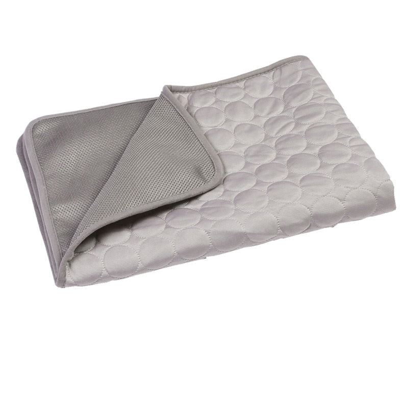 Grey textured pet self cooling mat with patterned surface on a white background