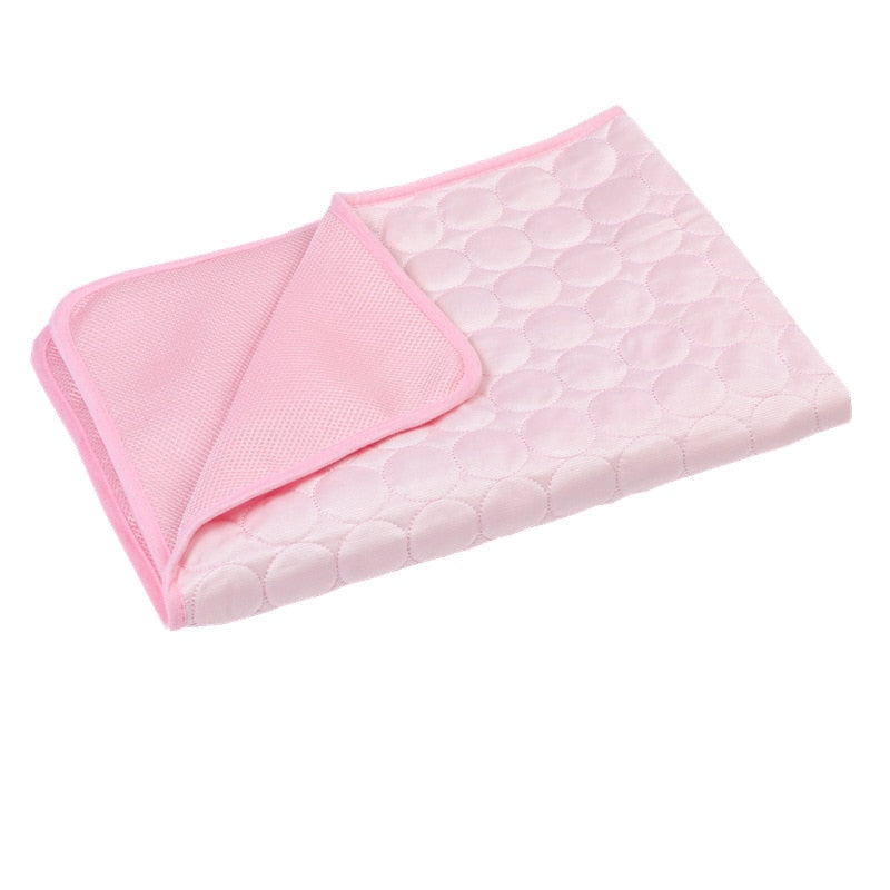 Pink self cooling mat on a white background