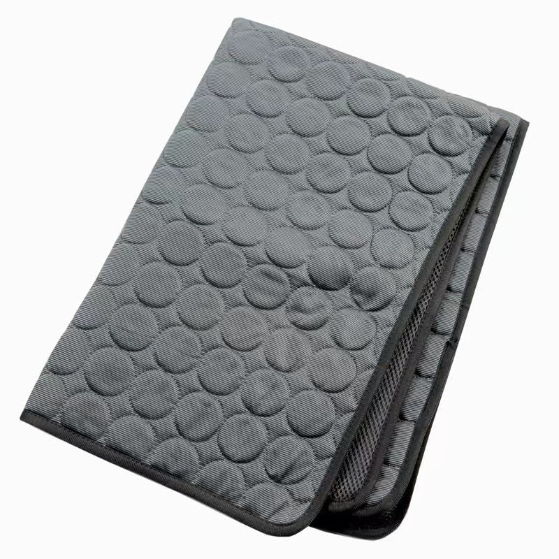 Grey pet self cooling mat with a textured pattern on a white background