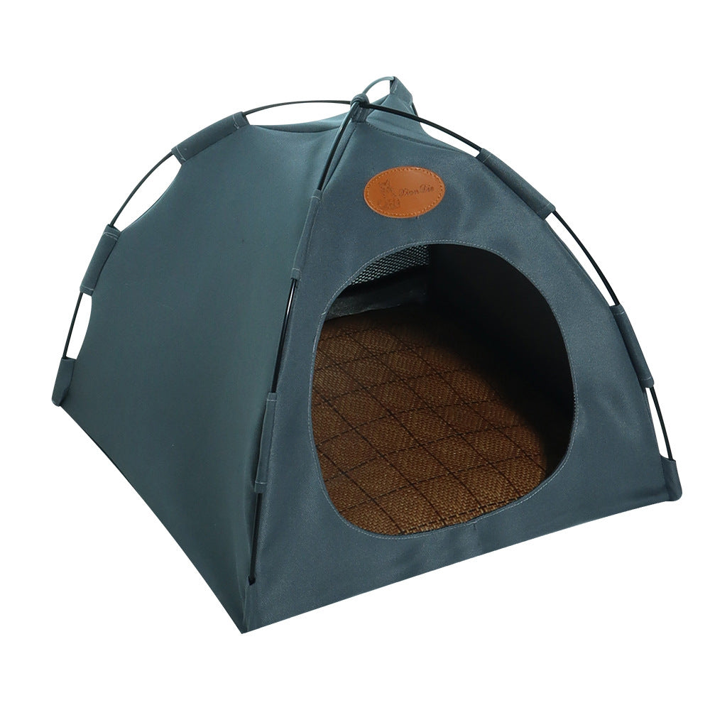 Grey pet tent with a brown cushion inside on a white background