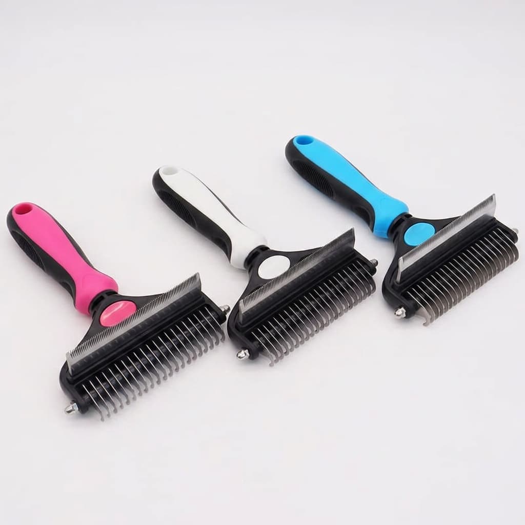 pink, white and blue 2-in-1 pet deshedding and dematting brushes displayed side by side on white background