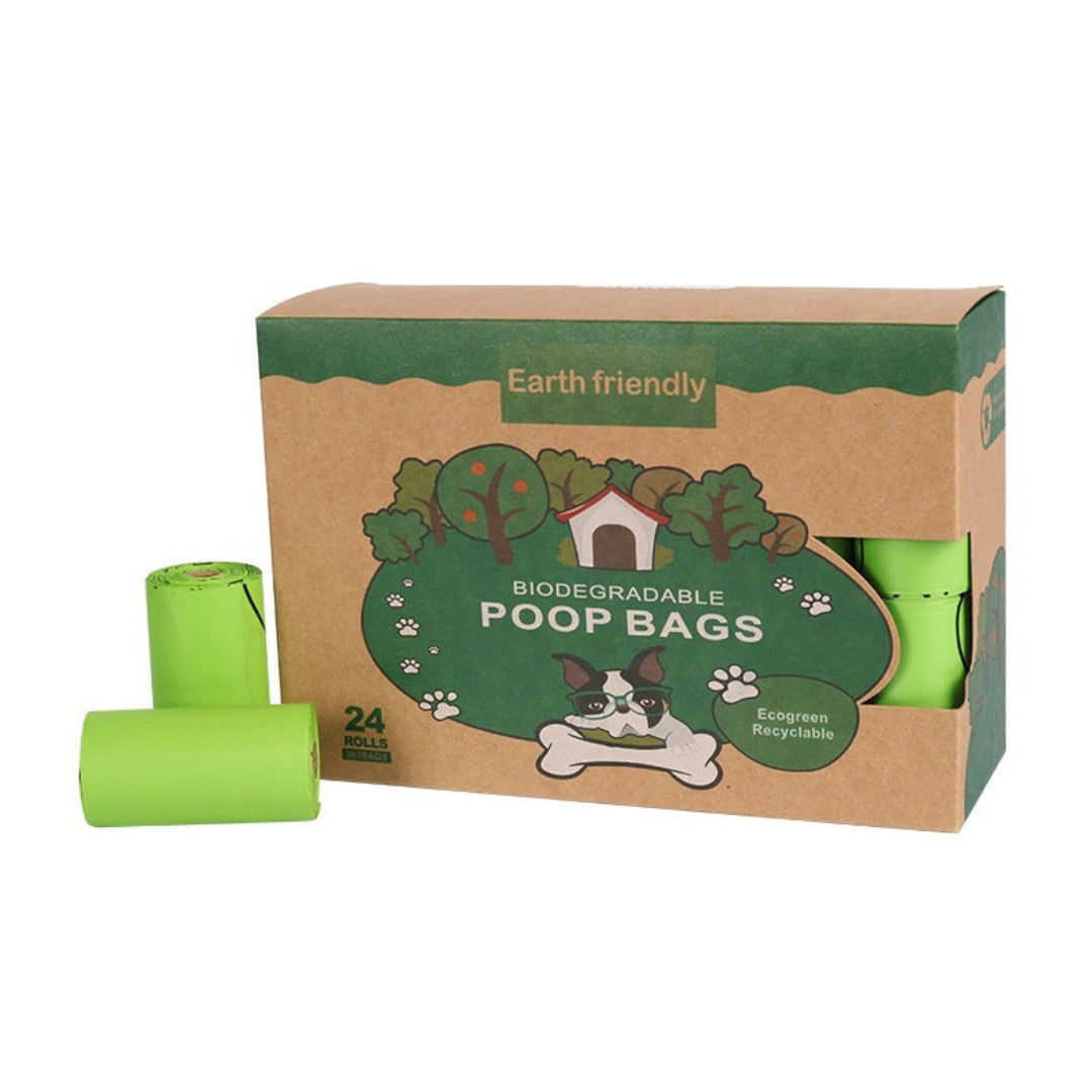 Box of Earth-friendly biodegradable poop bags with green bags on a white background