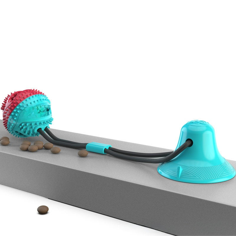 Dog toy with a ball and rope on a white background