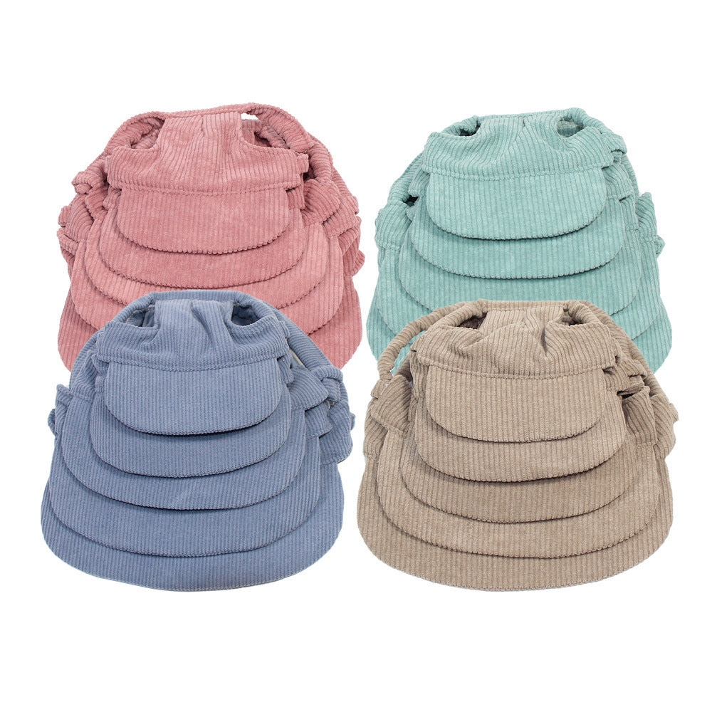 Four corduroy bags in pink, blue, green, and beige on a white background