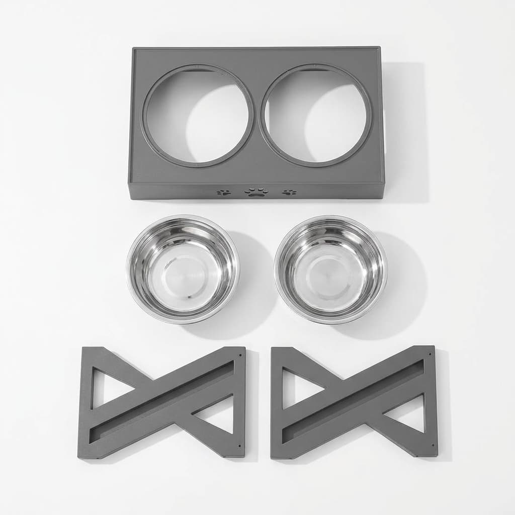 A pet feeding set arranged on a white background, including a grey rectangular base with two circular cutouts, two stainless steel bowls, and two matching dark grey bracket pieces.