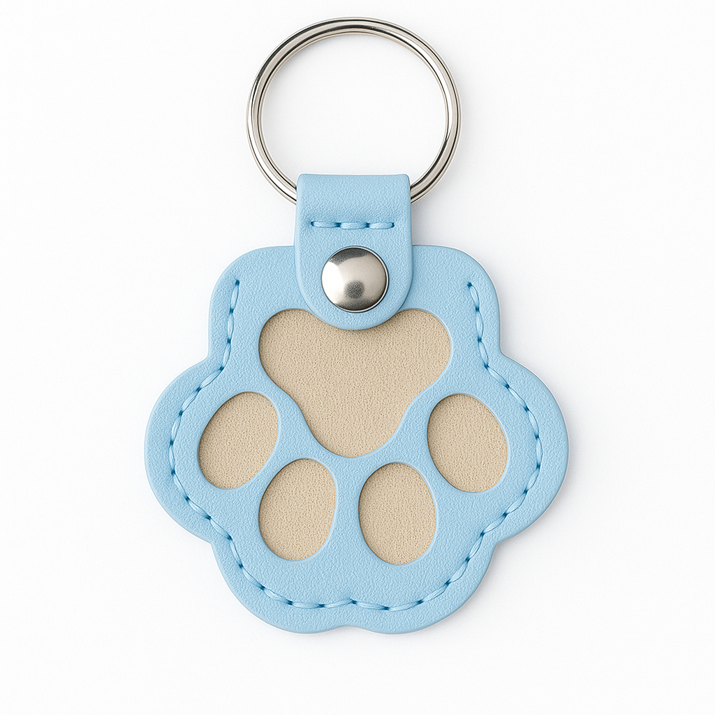 Blue paw print keychain with a silver ring on a white background