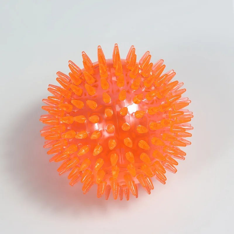 Orange spiky ball on a light gray background