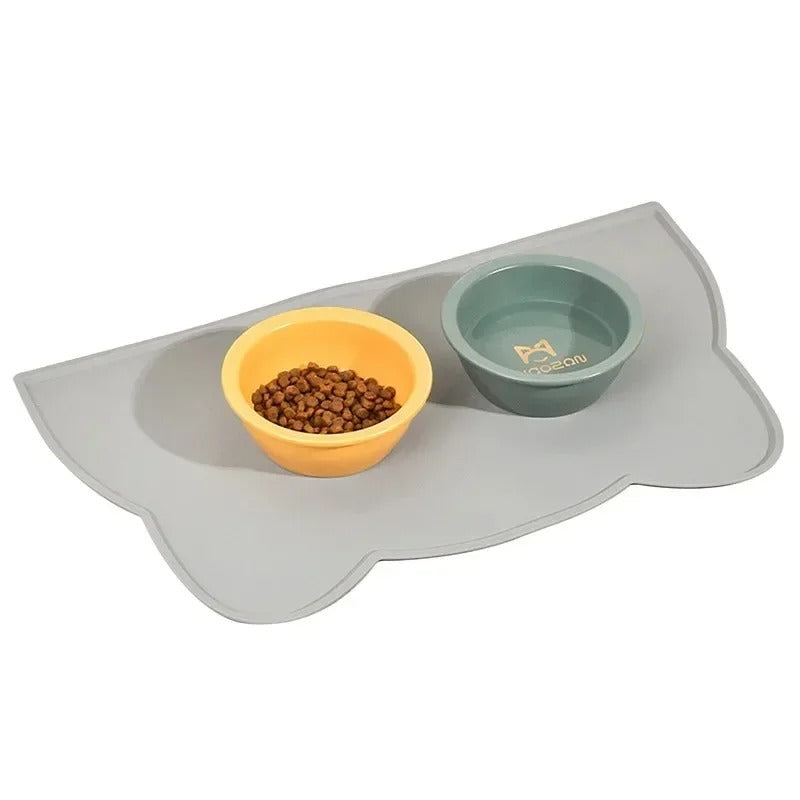 Pet feeding mat with two bowls on a white background